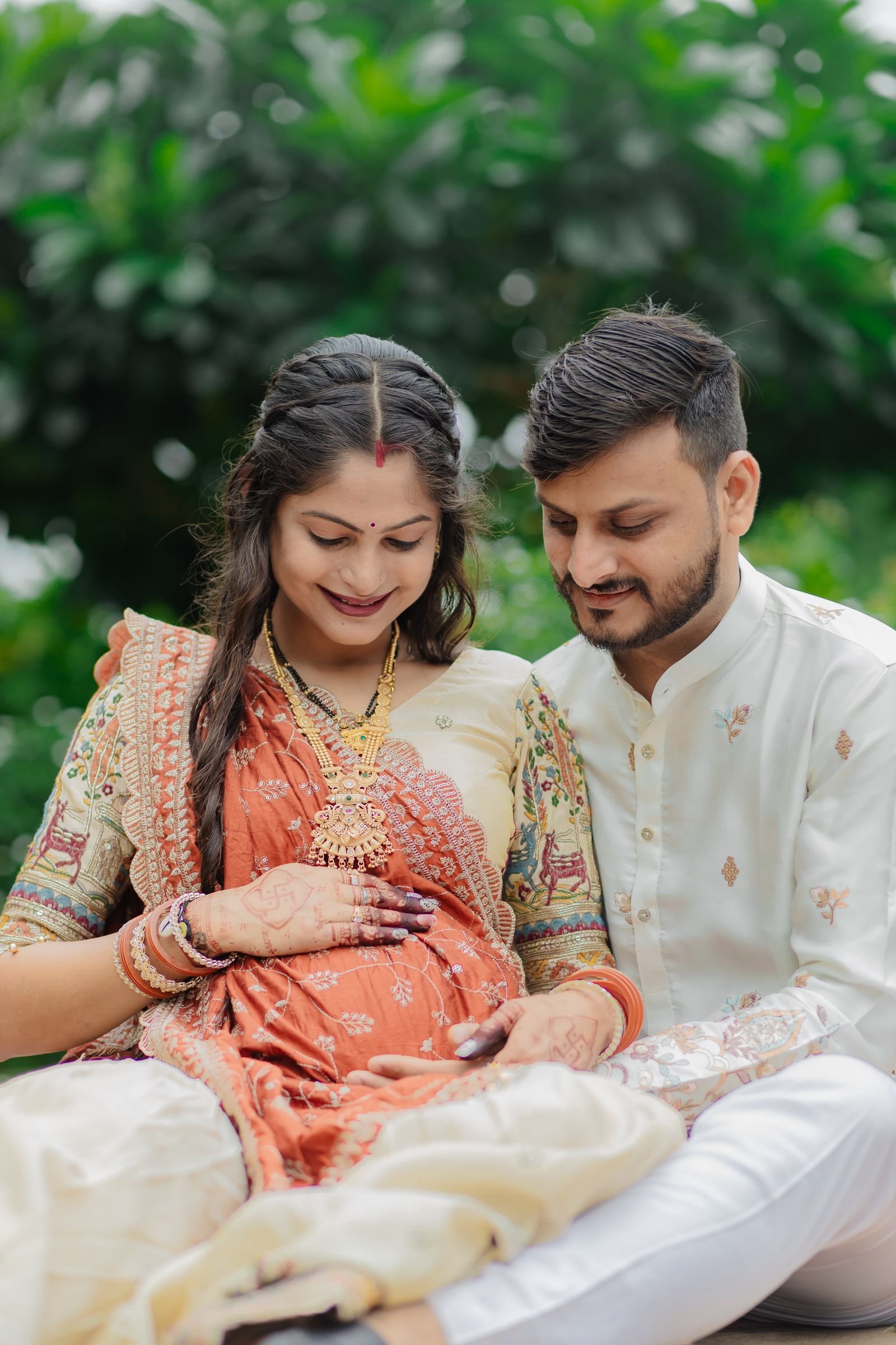 Expectant parents embracing during their pregnancy journey